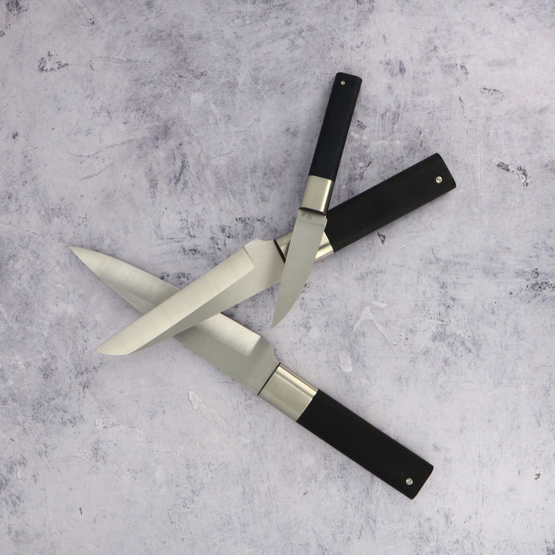 Knife set crossing each other on marble table