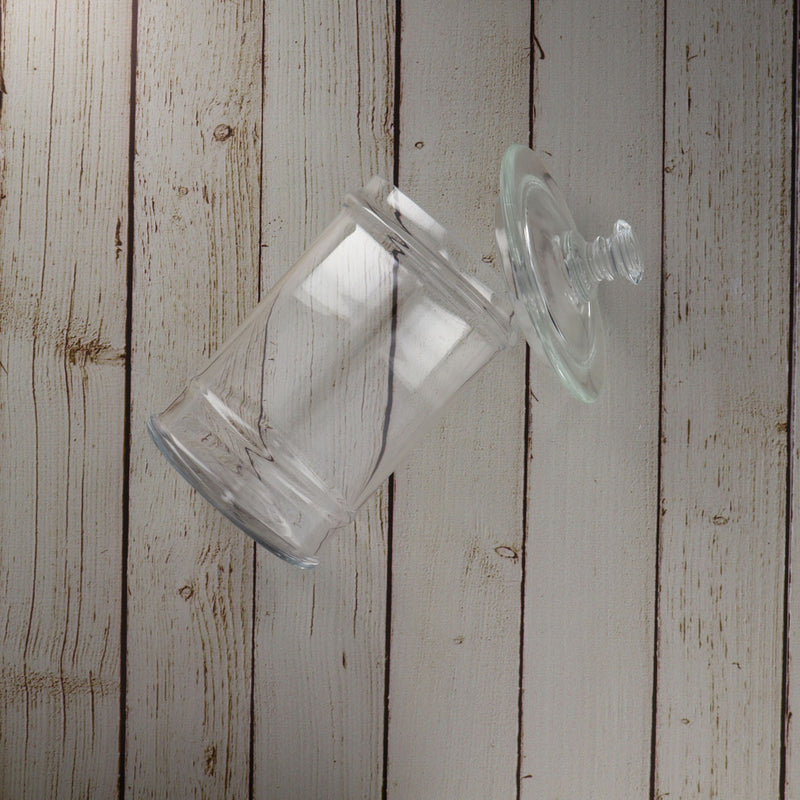 La Rochere Jar with its Lead on White Wood Table