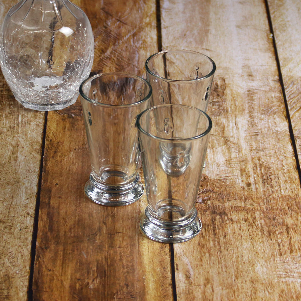La Rochere Three Long Glasses Drink Abeille on Wood Table