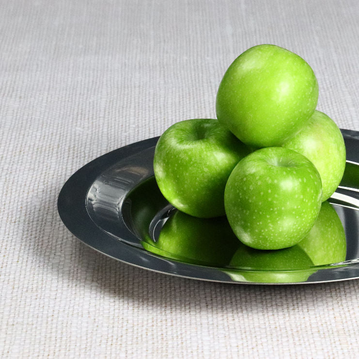 Degrenne Round deep dish on linen with Three Green Apples